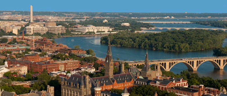Aerial view of Georgetown University with Washington Monument in background
